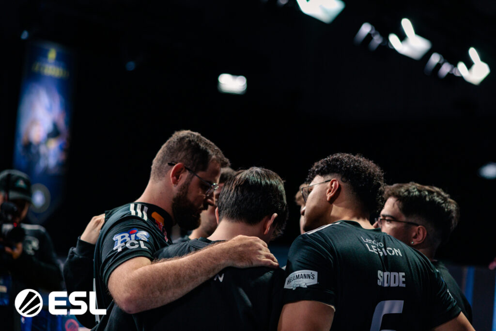 It's a tournament photo of the CS2 esports team FURIA at IEM Krakow 2026: during a pre-match hugs.