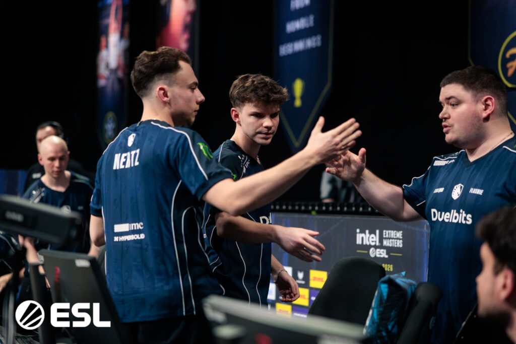 It’s a photo of the CS2 esports players from Team Liquid during the Counter-Strike tournament IEM Kraków 2026 — greet each other after a match.