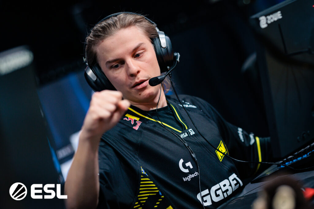 It’s a photo of the CS2 player Mihai "iM" Ivan from the team NAVI during the esports tournament IEM Kraków 2026: greets teammates during a match.