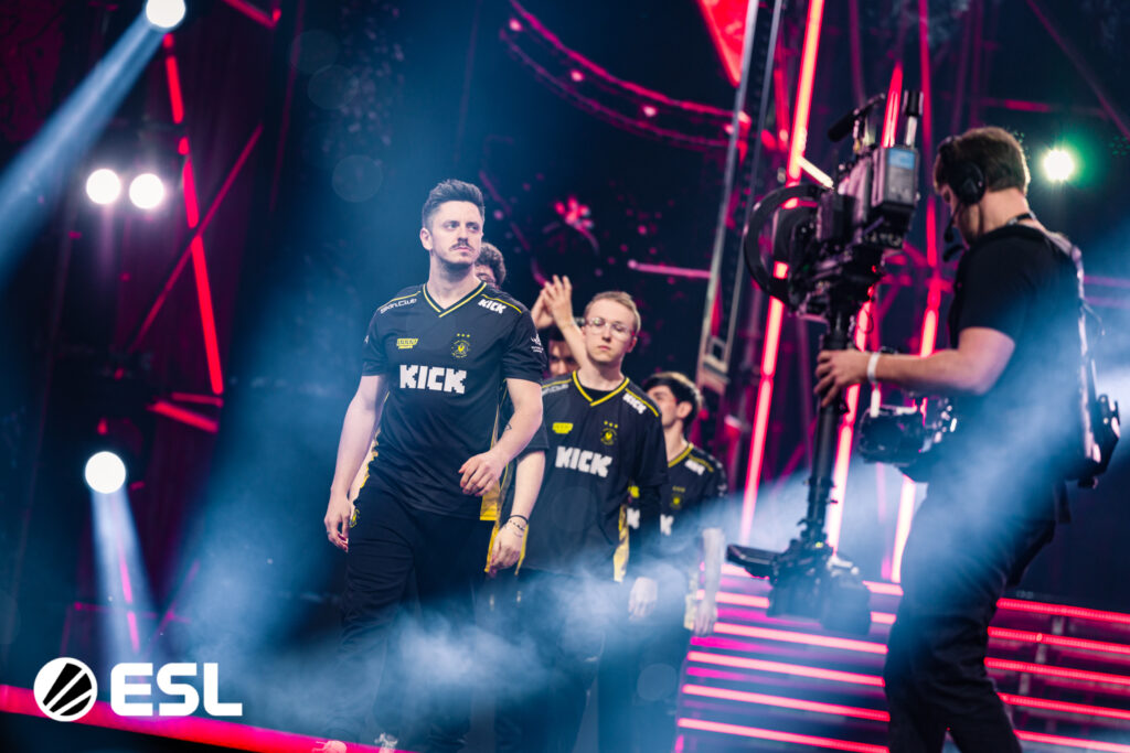 It’s a photo of the CS2 players from Team Vitality during the esports tournament IEM Kraków 2026: the players enter the main stage.
