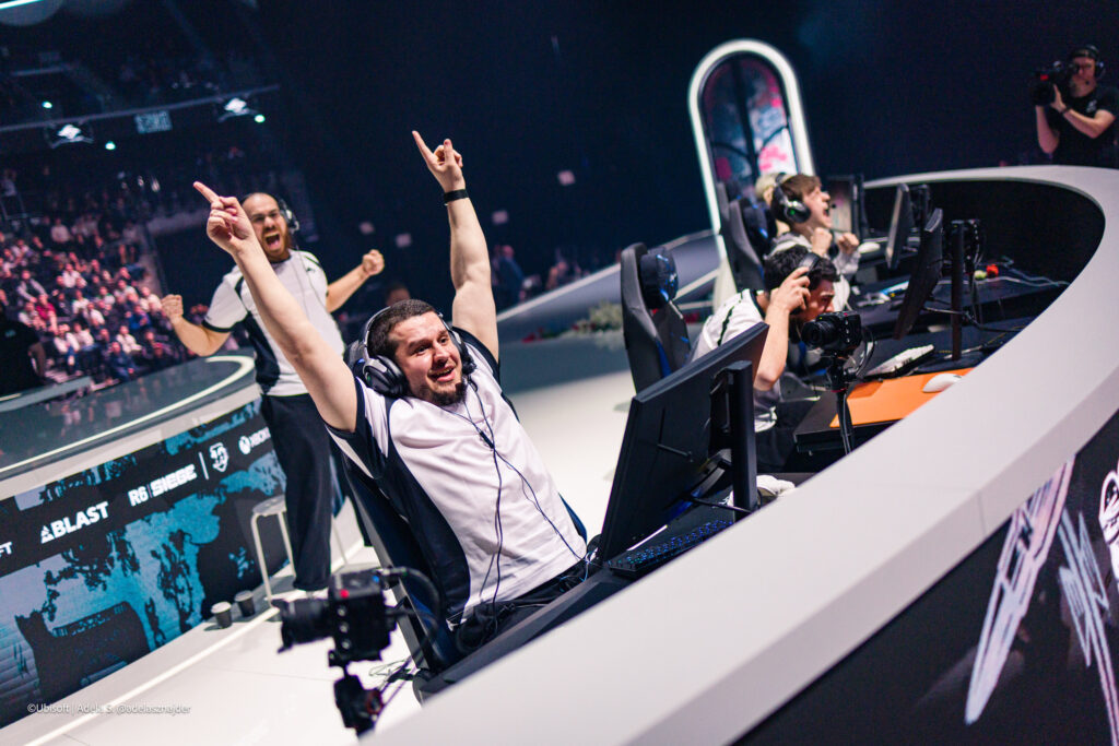 The Rainbow Six Siege X pro players from Team Secret during the Finals stage at the esports tournament Six Invitational 2026 — a photo, excited after winning the lower final versus Falcons.