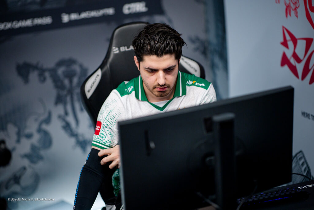 It’s a photo of the Rainbow Six Siege X esports player Fatih "Solotov" Türker from Team Falcons during the Playoffs stage of the tournament Six Invitational 2026: sitting in front of the computer.