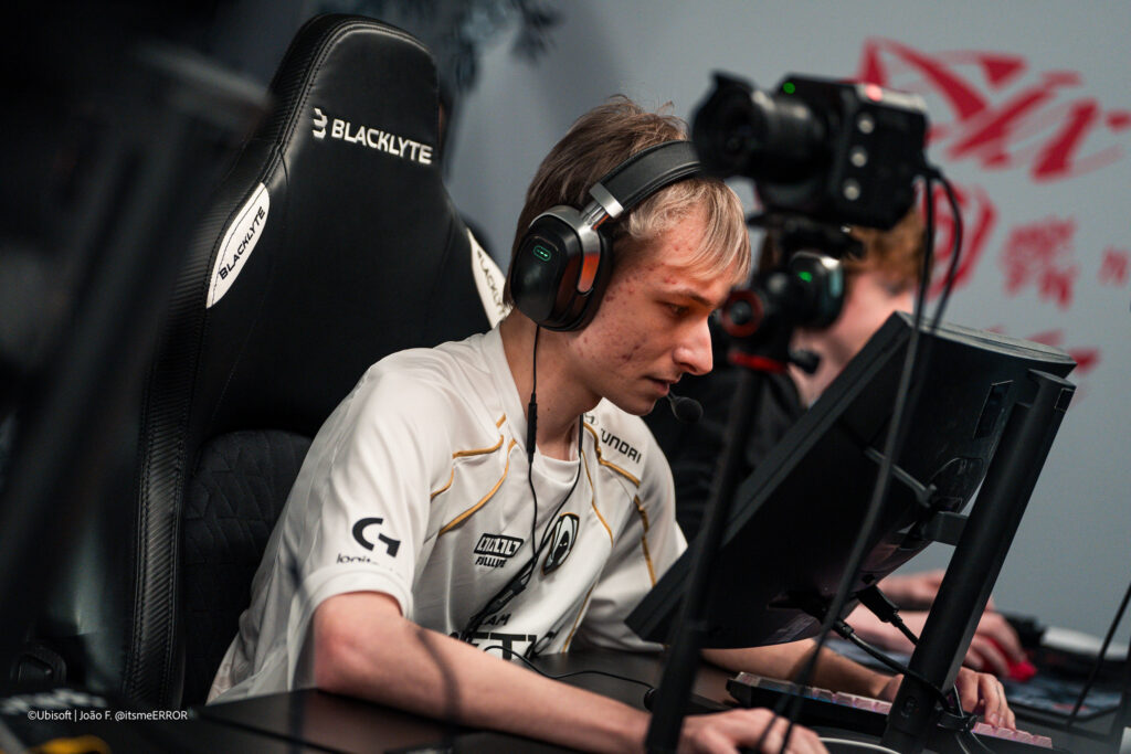 The Rainbow Six Siege X pro players from the team Team Heretics during the Playoffs stage at the esports tournament Six Invitational 2026 — a photo, focused in front of a computer during a match.