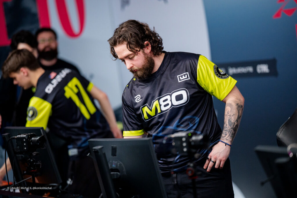 The Rainbow Six Siege X pro players from the team M80 during the Playoffs stage at the esports tournament Six Invitational 2026 — a photo, somewhat sad after losing a match.