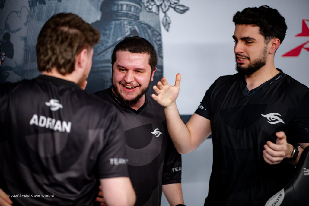 It’s a photo of the Rainbow Six Siege X esports players from Team Secret during the Playoffs stage of the tournament Six Invitational 2026: man handshakes after the match.