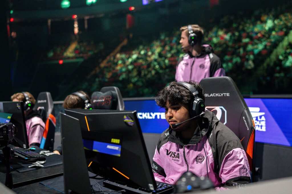 It’s a photo of the Rocket League esports players from Gentle Mates: on the stage of the tournament RLCS 2026 Boston Major, competing during a playoff match.
