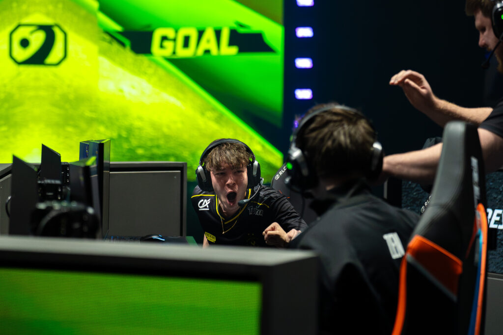 It’s a photo of the Rocket League esports players from Team Vitality: on the stage of the tournament RLCS 2026 Boston Major, excited during a playoff match.