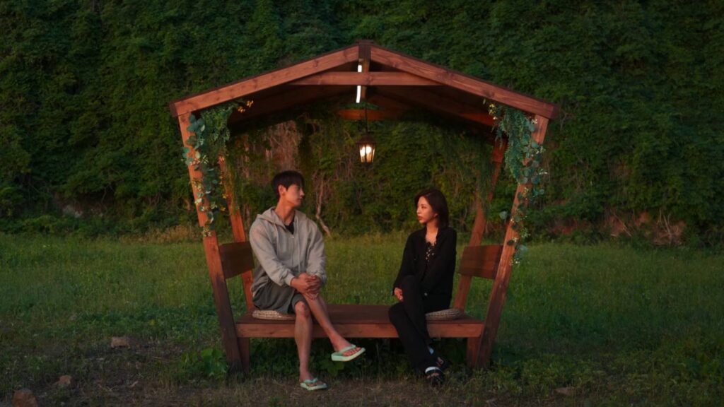The image features two participants of Single’s Inferno Season 5: Jo I-geon and Kim Go-eun on the inferno island.