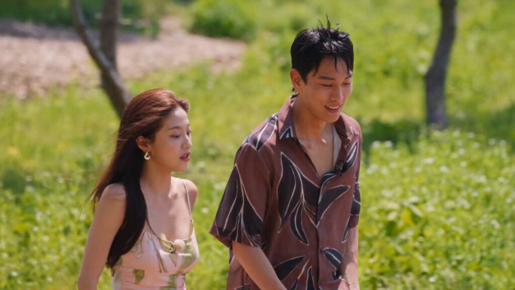 The image features two participants of Single’s Inferno Season 5: JKim Jae-jin and Lee Joo-young on the inferno island.