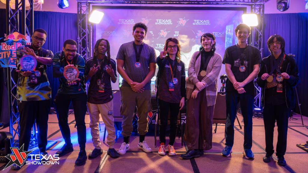 The photo features the top 8 players at the 2XKO esports tournament at the event Texas Showdown 2026.