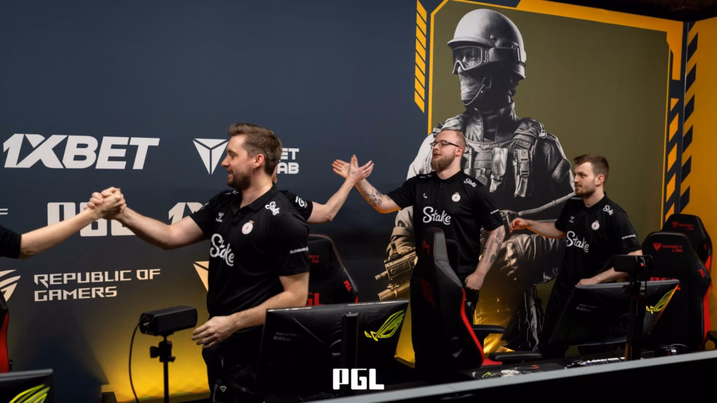 It’s a photo of CS2 players from the team Astralis during the Counter-Strike 2 esports tournament PGL Bucharest 2026 - greeting each other after a successful match.